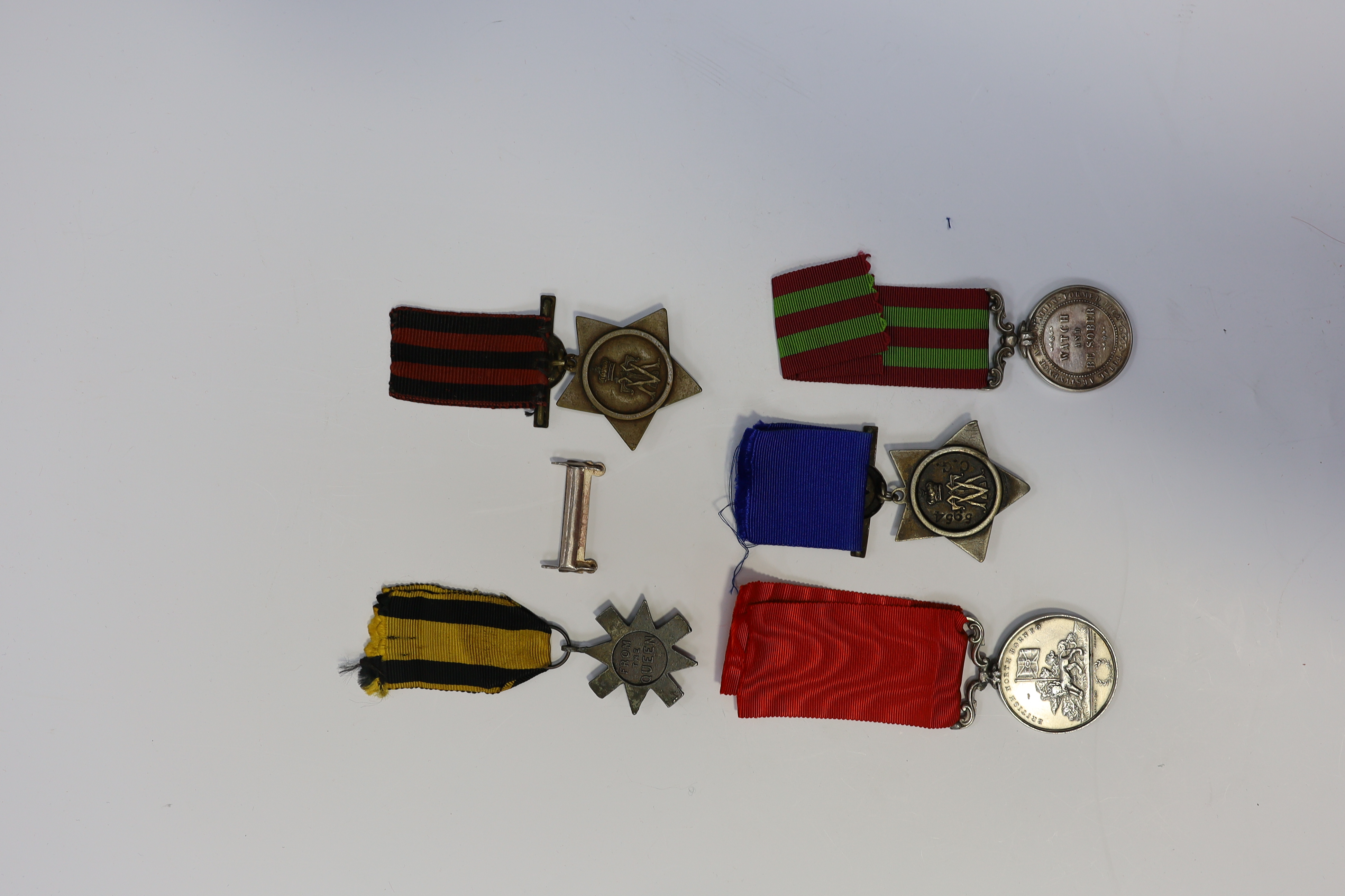 Replica medals; Khedive's Star 1884-6 and another undated; Ashanti star; Spink British North Borneo medal, a loose North West Frontier 1930-31 clasp and a Total Abstinence India medal 50-80